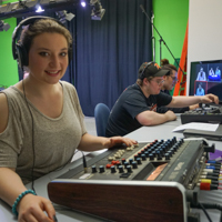 female student at video board