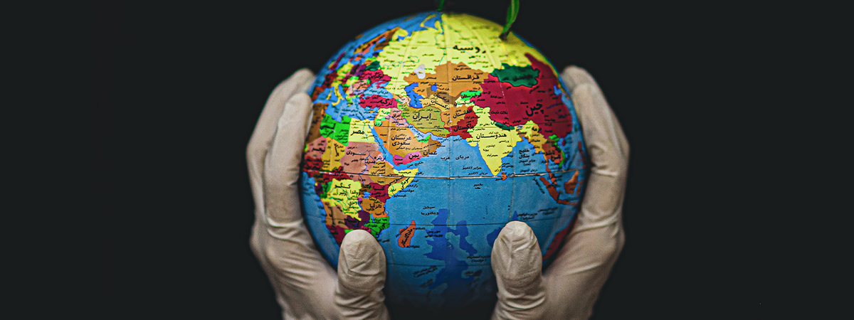 Hand holding a globe, Photo by Fateme Alaie on Unsplash